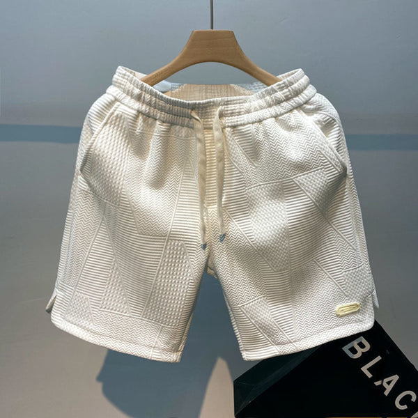 Witte sportshorts voor heren met golvend patroon, elastische tailleband en trekkoord. Ideaal voor hardlopen en casual sportactiviteiten.