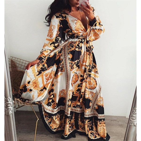 Wikkeljurk voor dames met split en V-hals, zomerjurk met barokprint in zwart, wit en goud. Perfect voor elegante zomerse gelegenheden.