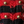 Rood-zwarte geruite stof met gouden knopen, textielontwerp, close-up. Modieuze stof, textuur, kledingmateriaal, gedetailleerd patroon.
